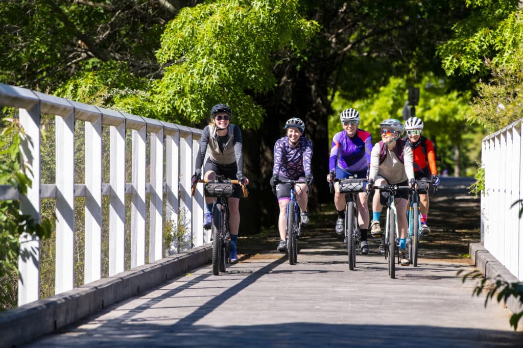 Beechworth Gravel Cycling Women on RailTrail Bridge