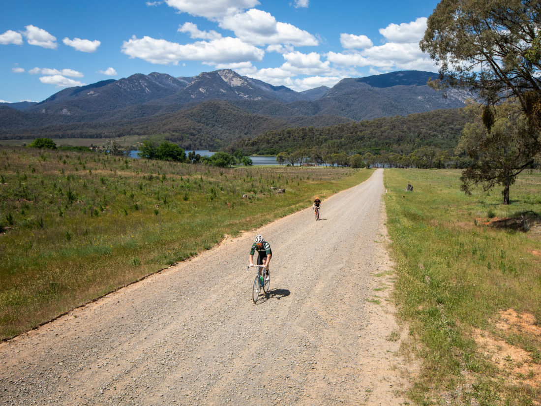 Riding on a gravel road with Mt Buffalo in the background